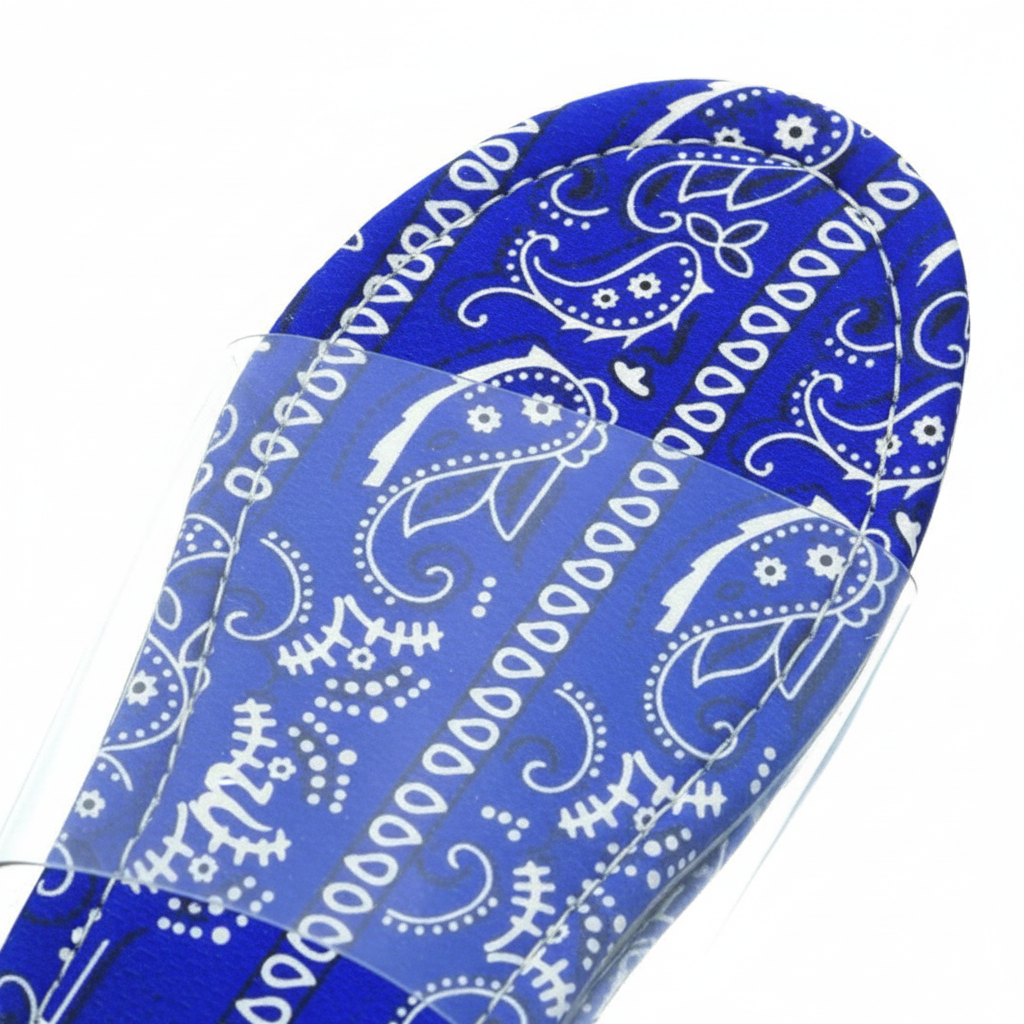 Sierra Blue Bandana Paisley Print Clear Strap Flat Slide Sandals – macro close-up of royal blue and white bandana paisley print footbed detail