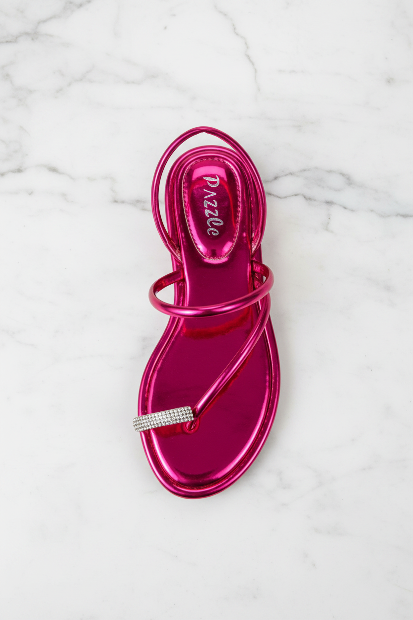 Nora Fuchsia Metallic Crystal Toe Ring Flat Sandals – top-down overhead view showing full sandal on white marble