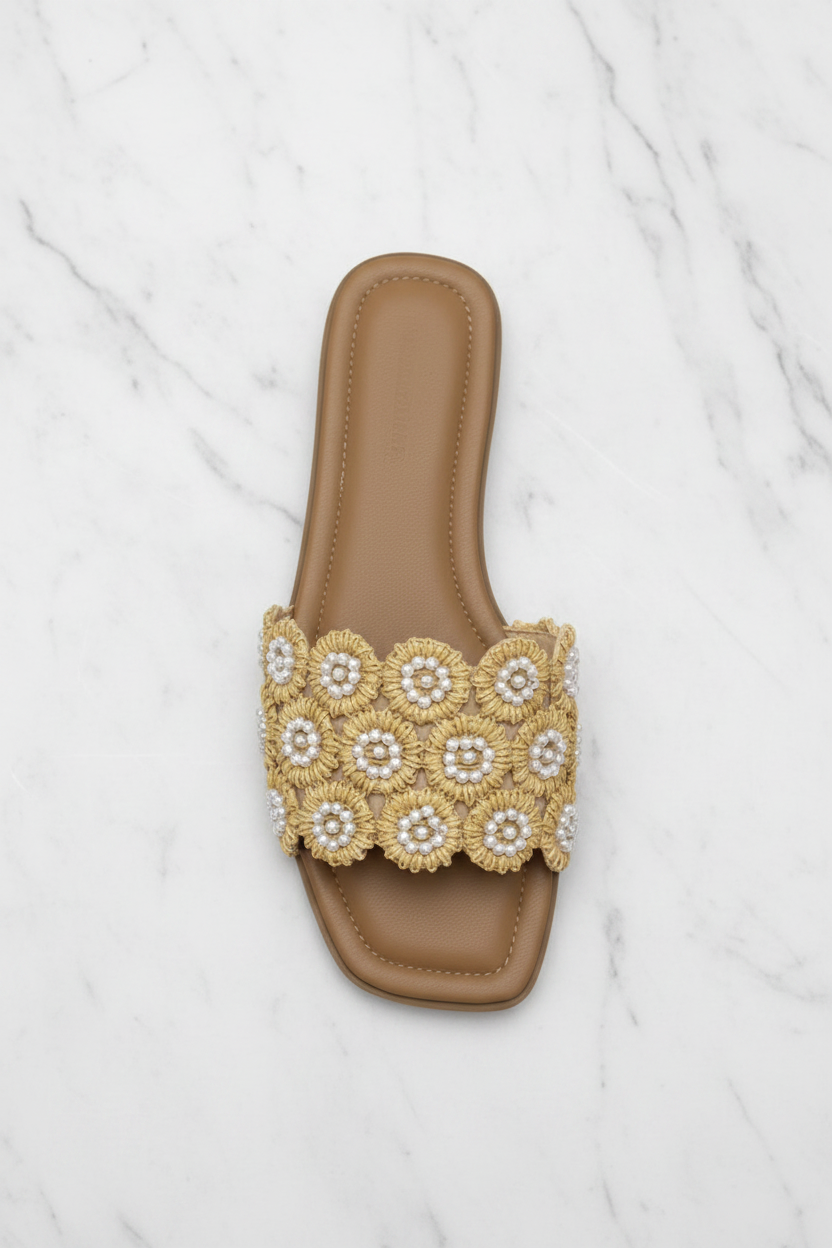 Tavo Nude Pearl Flower Raffia Flat Slide Sandals – top-down overhead view showing full sandal on white marble
