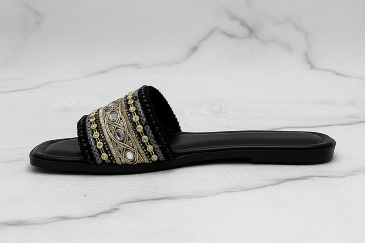 Black Gold Embroidered Crystal Flat Slide Sandals – side profile view on white marble