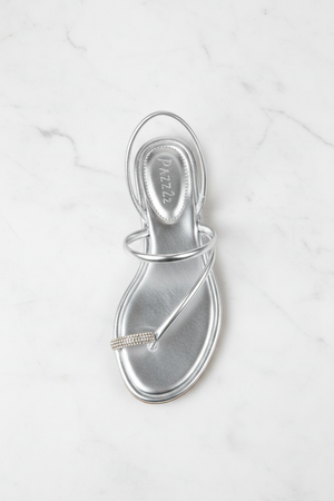 Nora Silver Metallic Crystal Toe Ring Flat Sandals – top-down overhead view showing full sandal on white marble