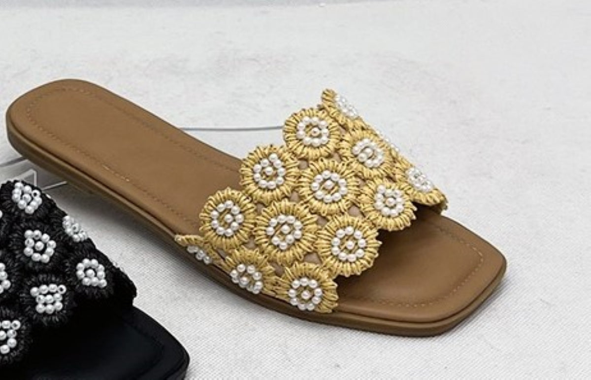 Tavo Nude Pearl Flower Raffia Flat Slide Sandals – product shot showing golden raffia woven flower rosettes with pearl bead embellishments on warm tan footbed