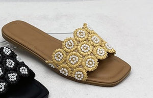 Tavo Nude Pearl Flower Raffia Flat Slide Sandals – product shot showing golden raffia woven flower rosettes with pearl bead embellishments on warm tan footbed